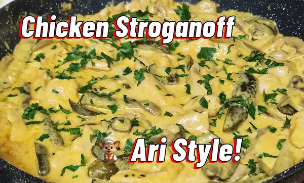 Creamy chicken Stroganoff with mushrooms, gherkins, and parsley, served Ari style in a skillet – bold, golden, and full of flavor.
