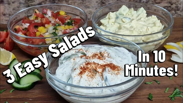 Three easy summer salads – creamy cucumber, tomato herb, and cheesy veggie salad – served in glass bowls on a wooden table.