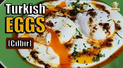 Turkish Eggs (Cilbir) served with creamy garlic yogurt, perfectly poached eggs, rich chili butter, and fresh parsley.