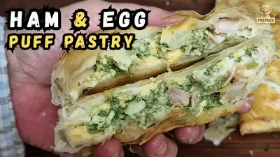 Golden puff pastries filled with chopped egg, smoked ham, leek, cheddar and homemade parsley garlic cream.